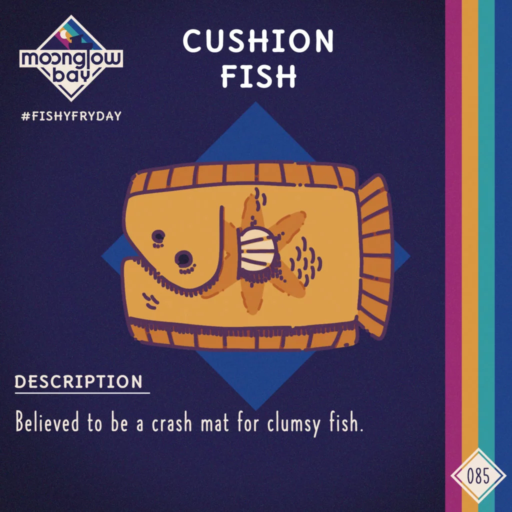Side view of a square, yellow, cushion shaped fish covered in fins with two eyes.